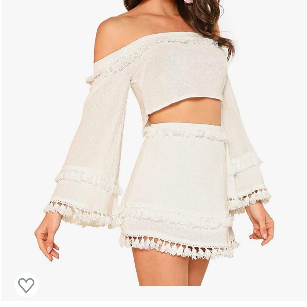 Cream colored skirt and crop top set.